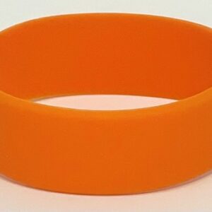 A close up of an orange bracelet on a white surface