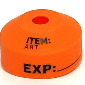 An orange item with a red dot on it.