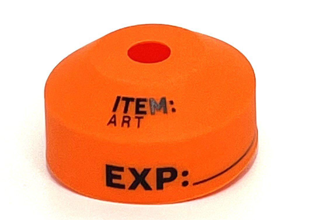 An orange item with a red dot on it.