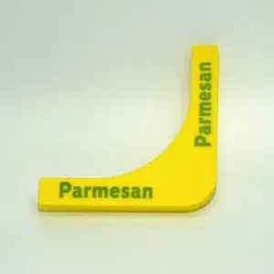 A yellow plastic object with the word parmesan written on it.