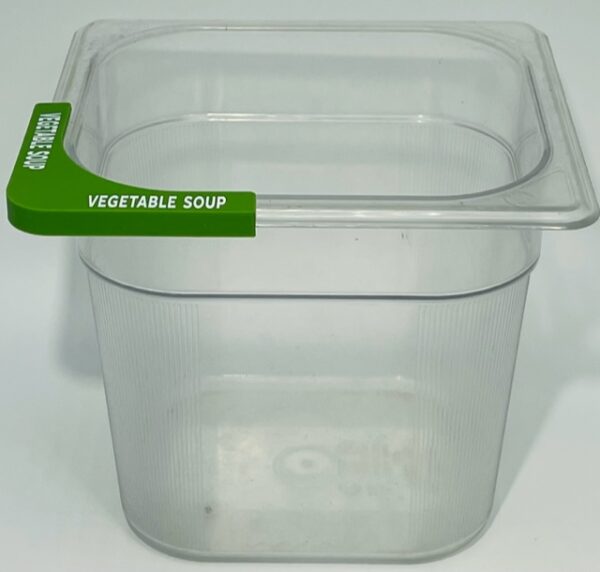 A plastic container with a green handle.