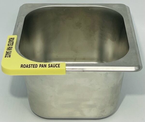 A metal pan with a yellow sticker on it.