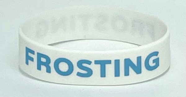 A white wristband with the name " rostine ".