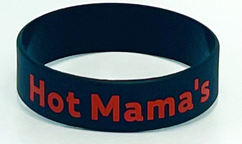 A black bracelet with the words " hot mama " written on it.