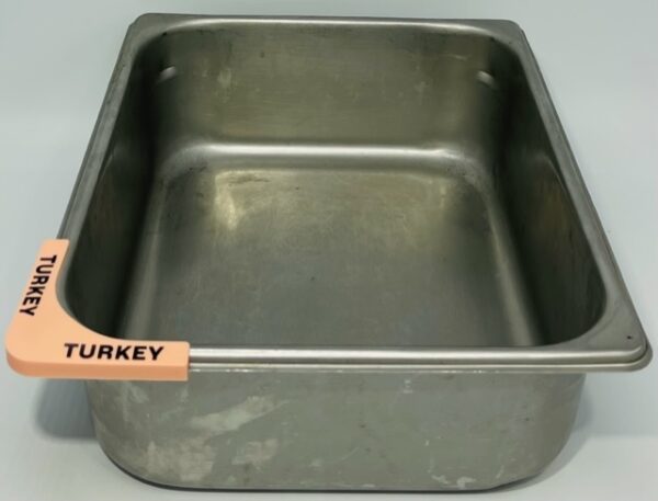 A metal pan with turkey written on it.