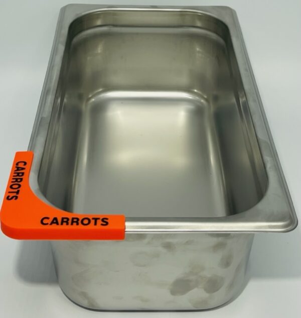 A metal container with carrots written on it.