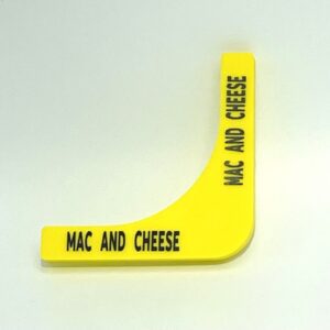 A yellow plastic object with the words mac and cheese written on it.
