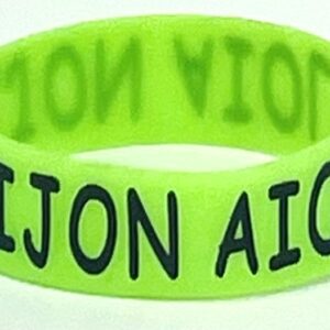 A neon green bracelet with the name aijon aigon.