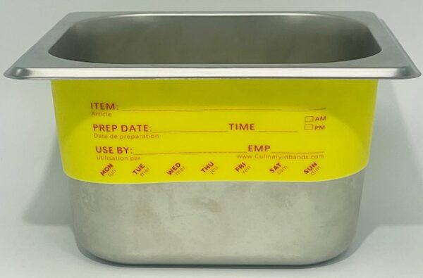 A metal container with yellow labels on it.