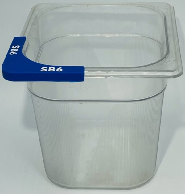 A plastic container with blue handle on top of white table.