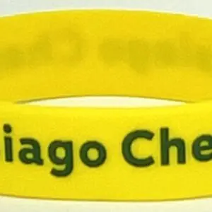 A yellow bracelet with the words chicago chess written on it.