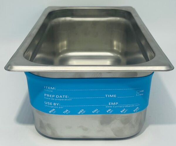 A metal pan with blue handles and a blue lid.