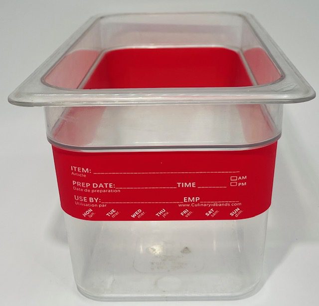 A red plastic container with the lid up.