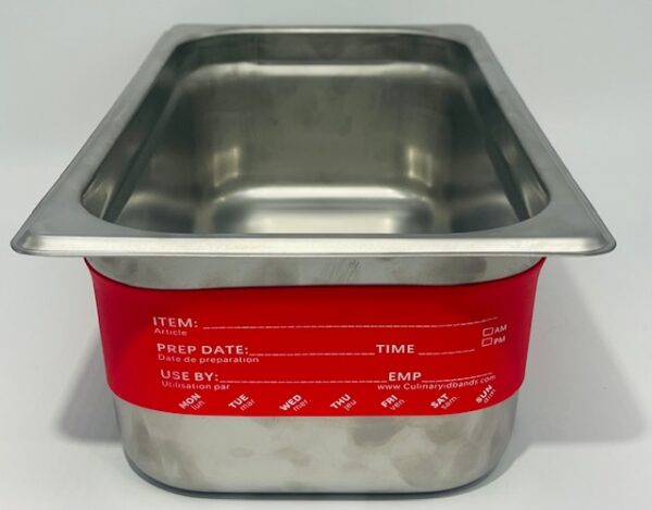 A metal pan with red banding on top of it.