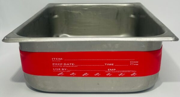 A metal container with red label on it.