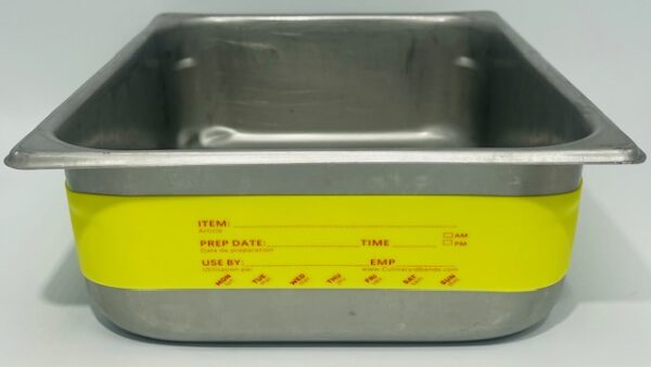 A metal container with yellow labels on it.