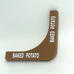 A brown wedge shaped object with the words baked potato written on it.