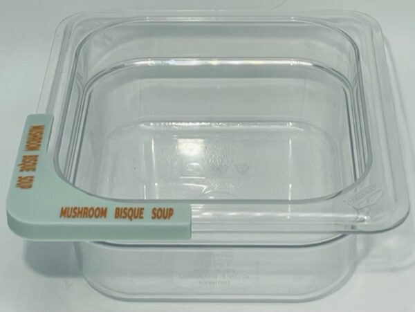 A clear container with a handle on top of it.