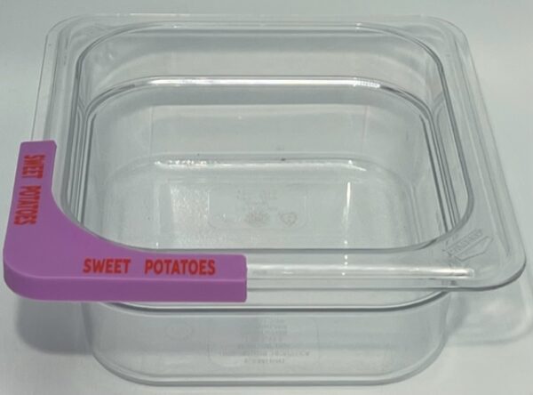 A plastic container with a purple handle.