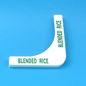 A white plastic object with green lettering on it.