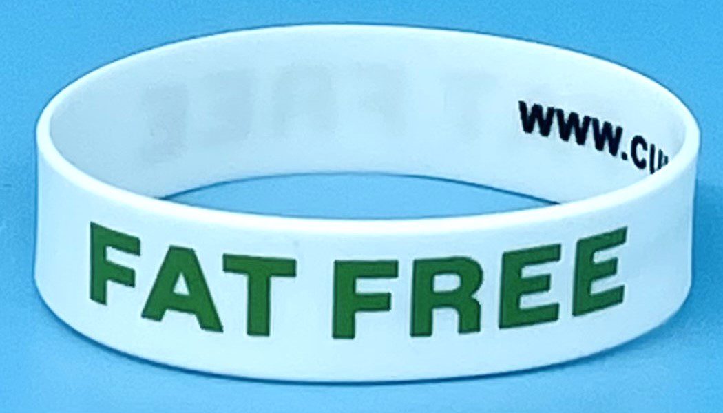 A white wristband with the words " eat fresh ".