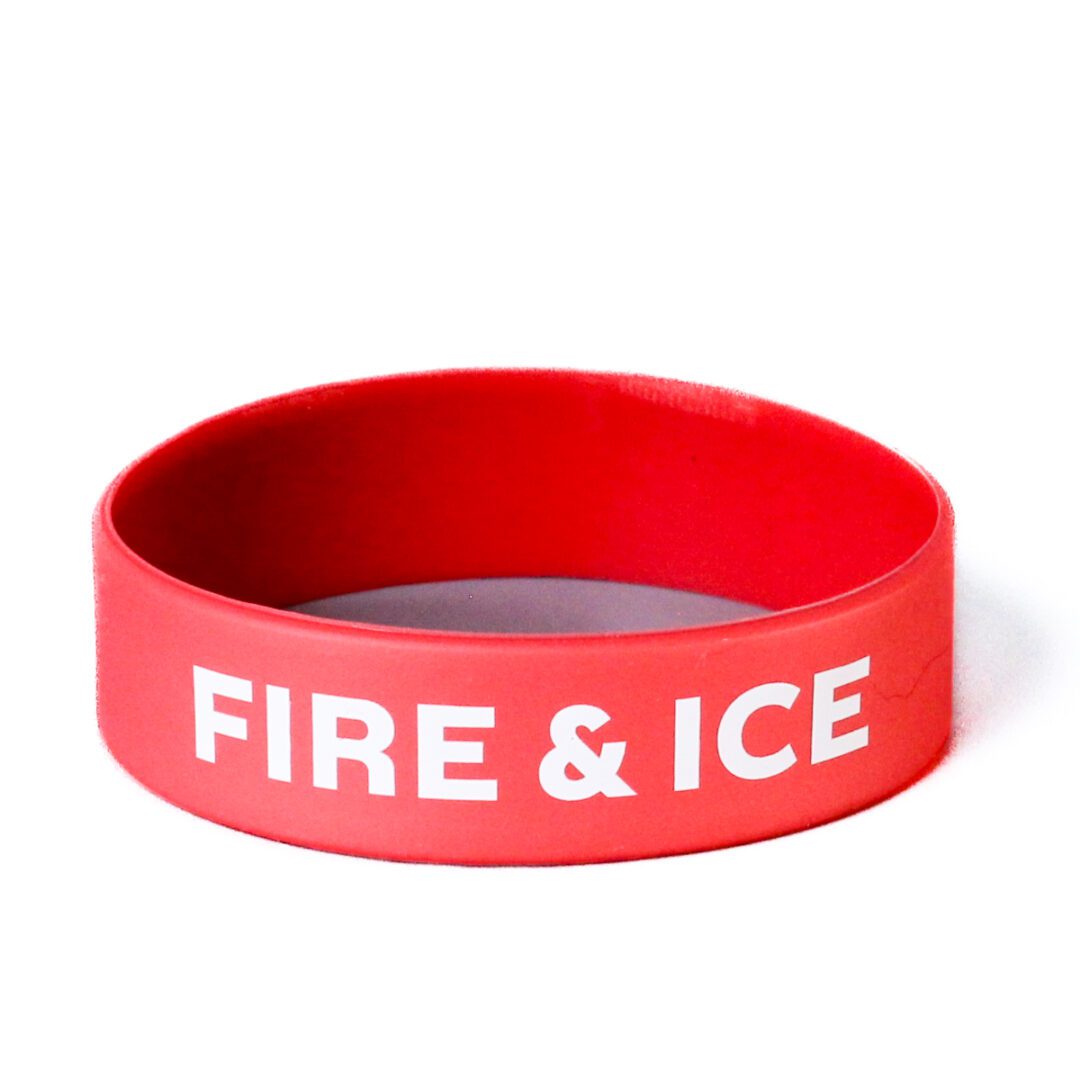 A red bracelet with the words fire and ice on it.