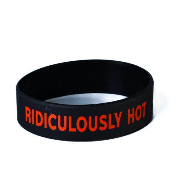 A black rubber bracelet with the words " ridiculously hot ".