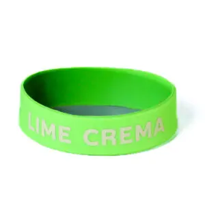 A lime green bracelet with the word " lime crema ".