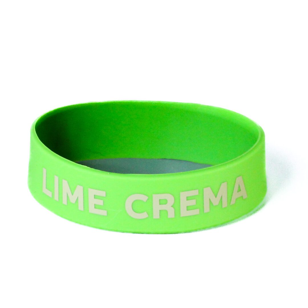 A lime green bracelet with the word " lime crema ".