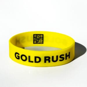Yellow wristband with "Gold Rush" text.