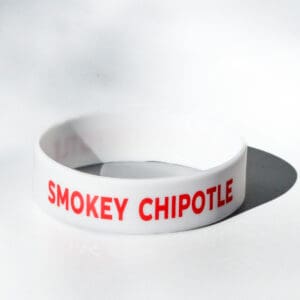 White wristband with "Smokey Chipotle" text.