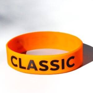 Orange wristband with "Classic" text.