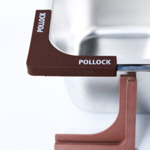 Brown corner protectors on metal tray.