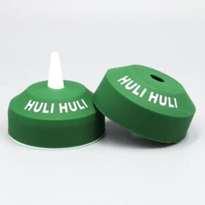 Green Huli Huli bottle caps on display.