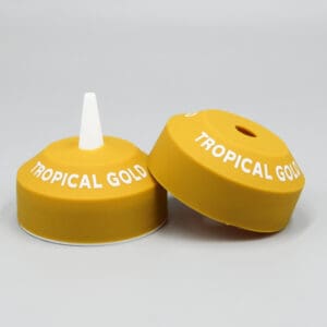 Yellow bottle caps labeled "Tropical Gold".