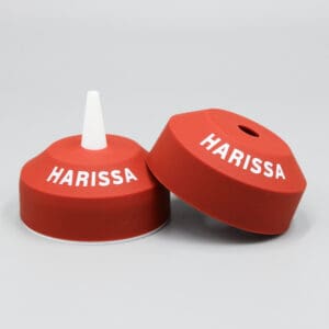 Red Harissa lids with white text.