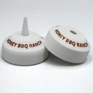 Honey BBQ Ranch bottle caps on display.