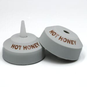 Two "Hot Honey" bottle caps.