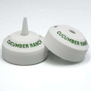 Cucumber Ranch dressing bottle caps, white background.