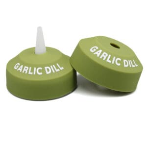 Garlic dill green bottle caps, white text.