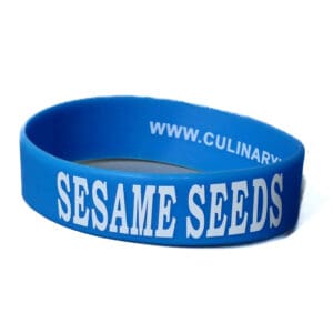 Blue wristband with "Sesame Seeds" text.
