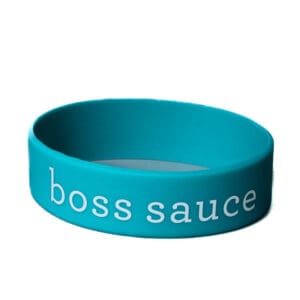 Blue wristband with "boss sauce" text.