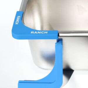 Blue corner guard on stainless steel surface.