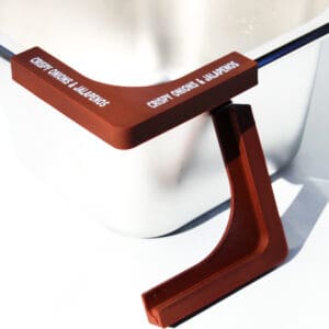 Container with lid labeled "Crispy Onions & Jalapeños".