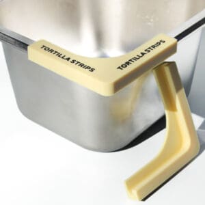 Tortilla strips holder on metal container.