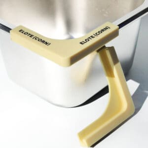 Corn holder attached to a metal container.