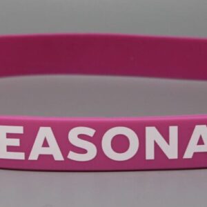 Pink wristband with "SEASONAL" text.
