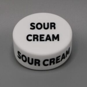White lid labeled "Sour Cream" on grey background.