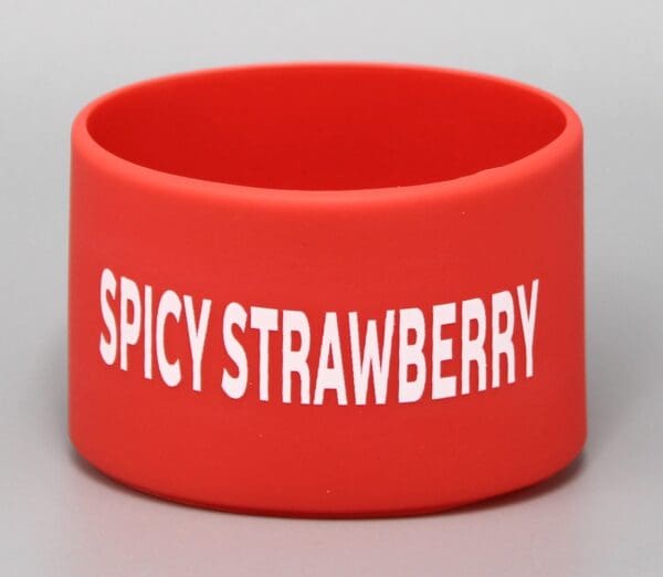 Red wristband with "Spicy Strawberry" text.